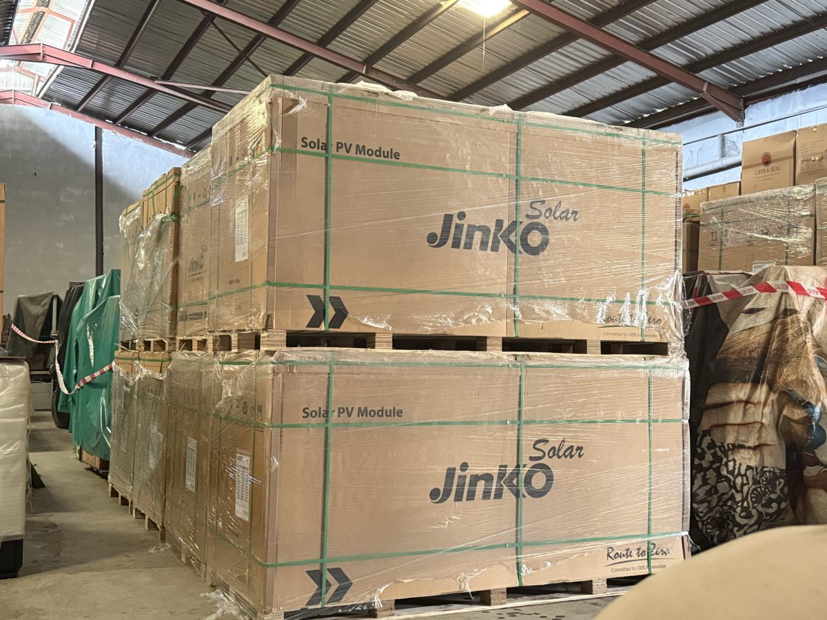 Factory-sealed pallets of Jinko Solar PV modules in InfraSol's Lagos warehouse